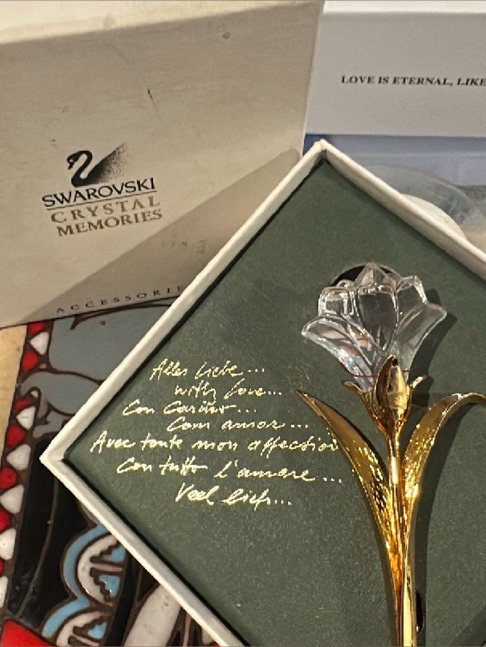 Swarovski Crystal Memories flower brooch w/gold-tone stem & clear crystal bloom